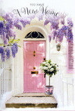 This image offers a glimpse of a Sutton doorway transformed into a gentle, floral embrace, as if ready to greet someone returning to their first night in a new home. At the centre stands a painted pink front door, its blush tone subtly luminous and calming, sitting comfortably within whitewashed walls that reflect the daylight in a soft, milky glow. The wall's faint texture gives the scene depth, suggesting a building with character rather than stark newness. Just beside the door is a pastel shutter, echoing the same softened palette and adding a hint of symmetry often seen along Sutton's quieter residential streets. Sweeping above and around the entrance, wisteria hangs in flowing strands, its blossoms a dreamy mixture of lavender and lilac. The flowers cluster along slender stems, cascading like delicate curtains that you might brush aside as you step inside, recalling established gardens found near Carshalton or along the River Wandle. On the doorstep, a grey metal bucket stands as a simple yet stylish vessel, brimming with an arrangement of white and cream roses. The roses are full and plush, their petals unfurling slowly in rounded spirals, while touches of fresh green foliage weave between them, bringing a lively contrast and hinting at freshly cut stems. A soft pink ribbon is tied around the bucket's base, the satin bow echoing the door's colour and pulling together all the gentle pastels of the scene. The overall impression is one of quiet celebration and calm excitement, the kind of floral welcome that might greet a family or couple as they cross the threshold of their new Sutton home, symbolising comfort, hope, and the promise of happy days ahead.